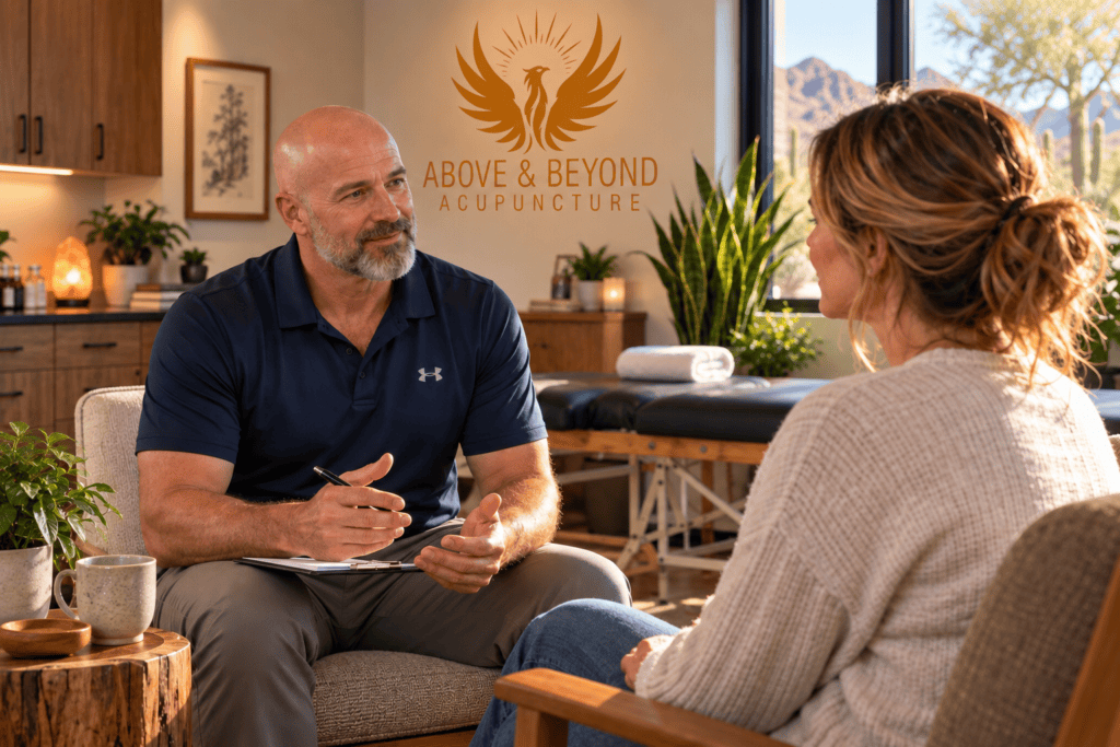 Acupuncturist speaking with a patient about her overall health and wellness in a warm Scottsdale acupuncture clinic.