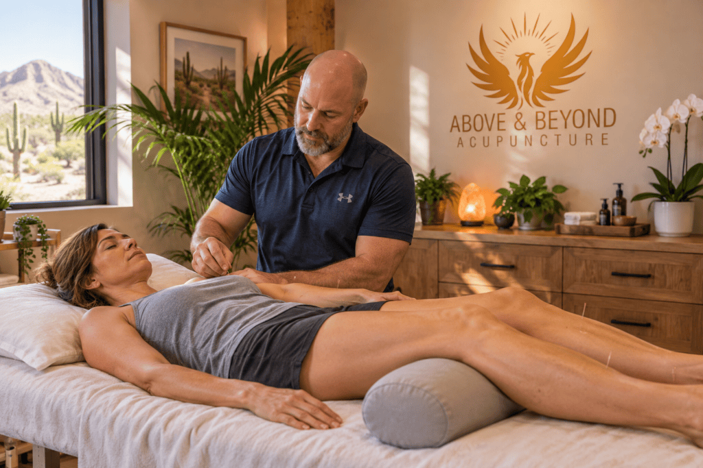 Patient receiving acupuncture in a calm treatment room as part of a holistic approach to inflammatory symptoms.