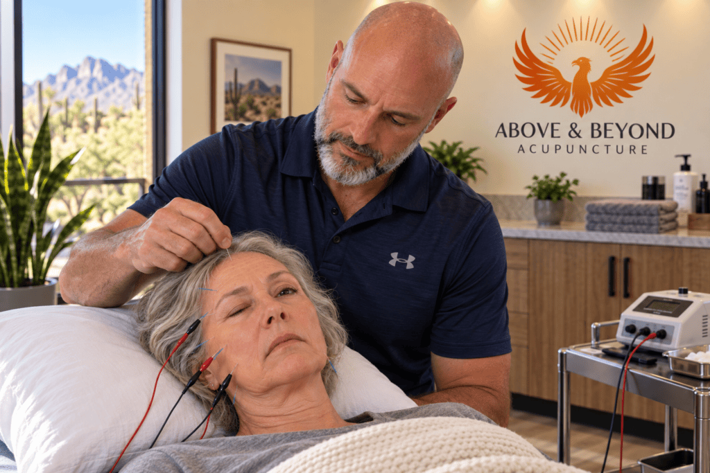 Woman with Bell’s palsy receiving facial acupuncture with gentle electrical stimulation.