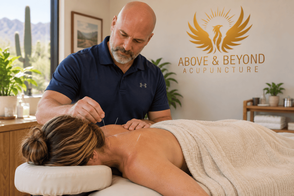 Woman receiving acupuncture for chronic neck and shoulder tension at Above & Beyond Acupuncture.