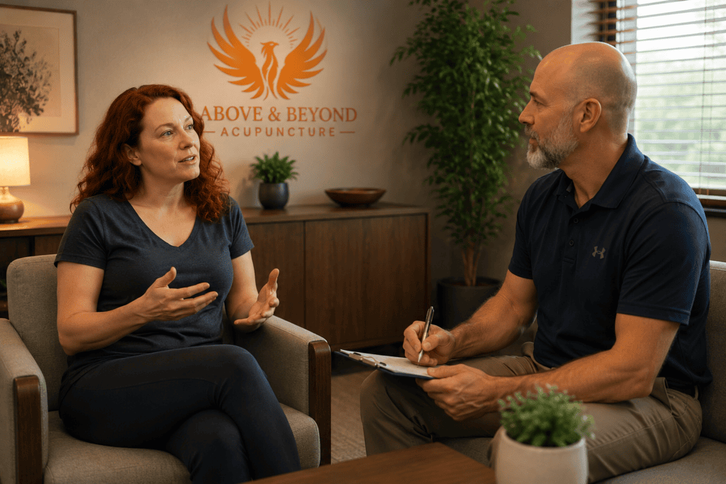 Woman discussing her progress with her acupuncturist during a follow-up appointment.