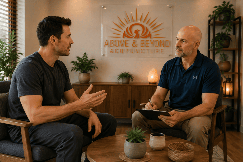 Man asking his acupuncturist a question during a calm follow-up conversation.