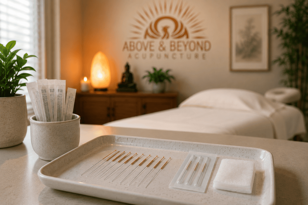 Fine acupuncture needles resting on a clean clinical tray in a calm treatment room.