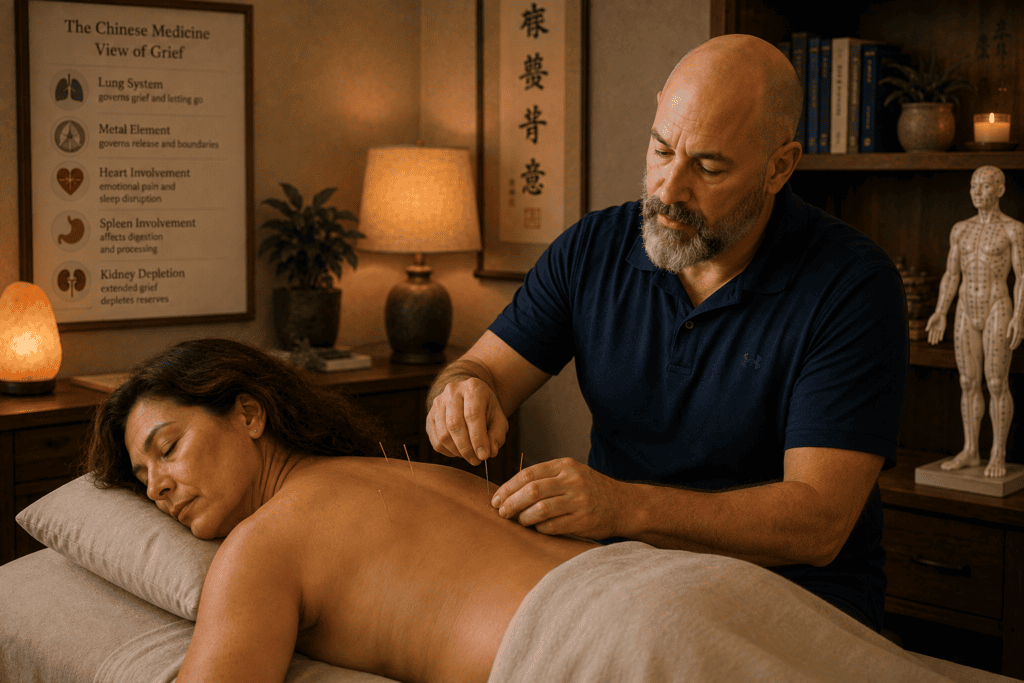 Licensed acupuncturist gently placing acupuncture needles on a patient during a treatment session for grief support.