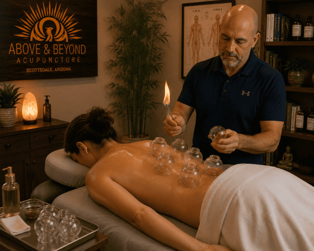 Patient lying comfortably on a treatment table preparing to receive a fire cupping treatment at Above and Beyond Acupuncture.