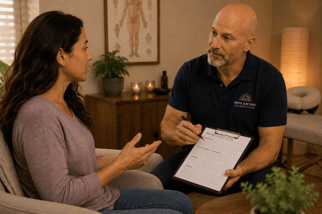 Patient discussing their medical history and medications with a licensed acupuncturist before treatment.