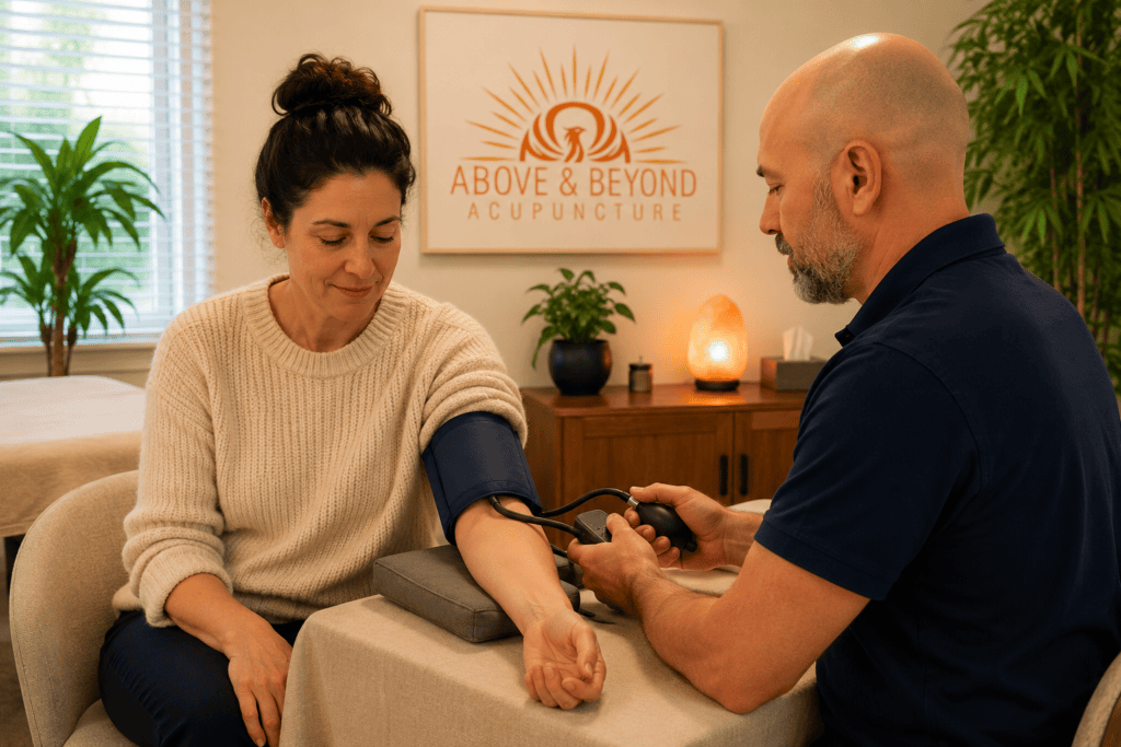 Person having their blood pressure checked with a cuff in a calm clinical setting.