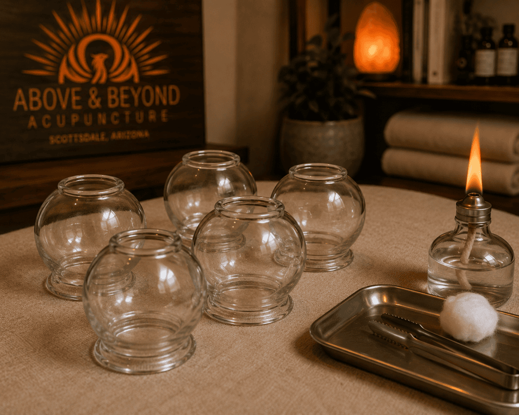Traditional glass cups arranged for fire cupping treatment showing the classical equipment used in this ancient Chinese medicine therapy.