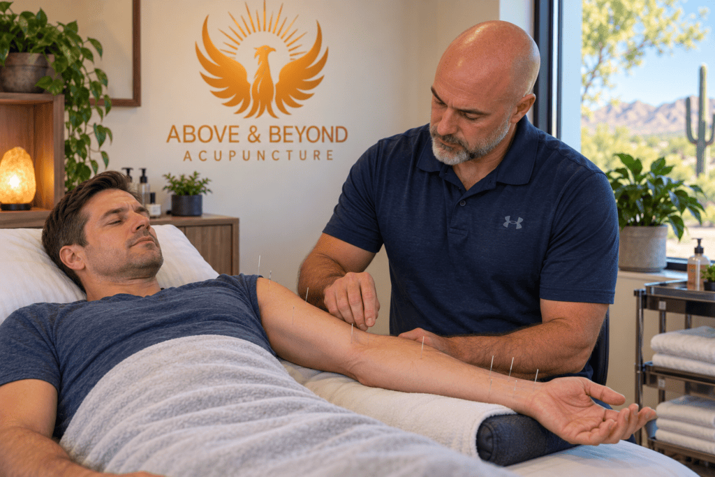 Man receiving acupuncture along the wrist, forearm and elbow as part of treatment for carpal tunnel symptoms.